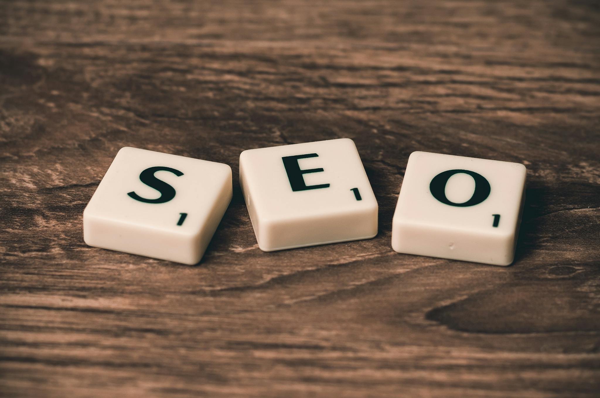 scrabble tiles spelling seo on a wooden surface. ideal for digital marketing themes. 270637 2048x1360